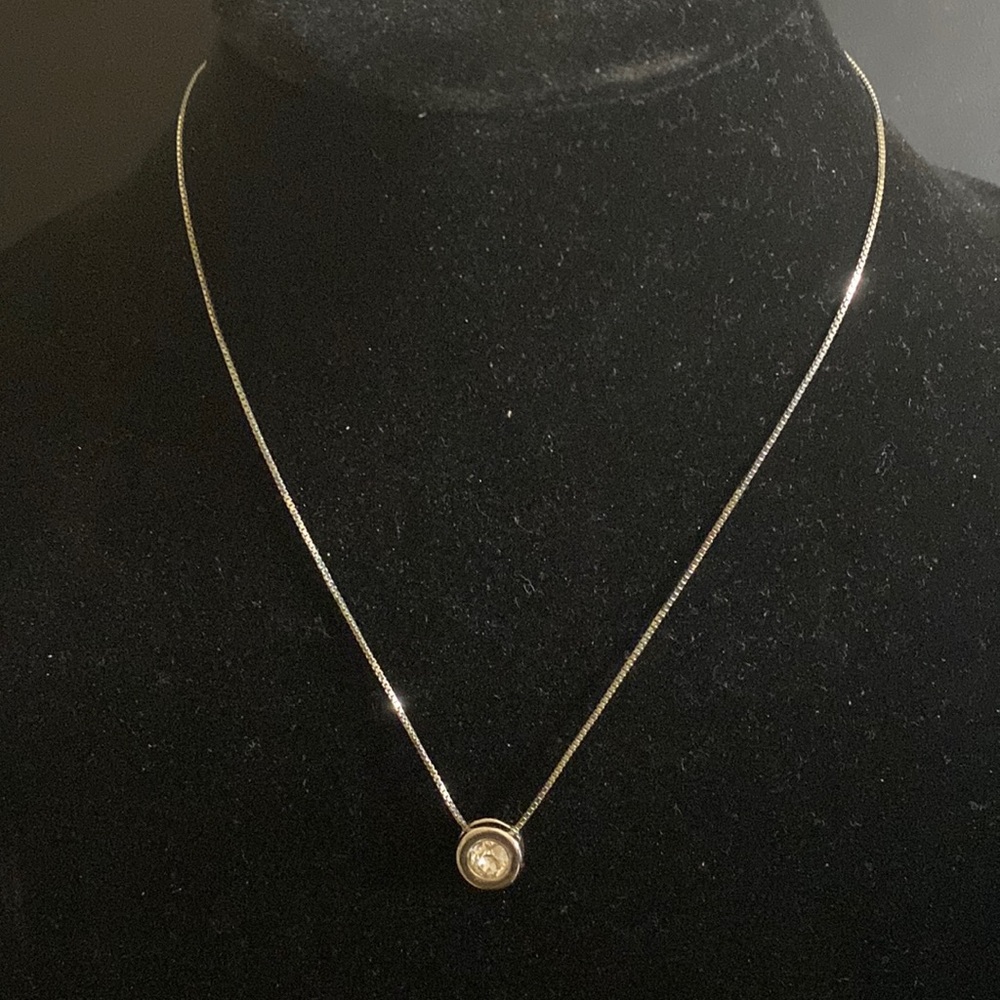 Silver necklace with a nice extension and zirconia stone